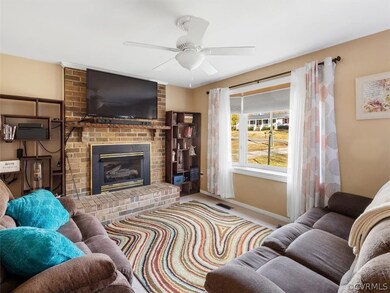 Family Room with Carpet and Ceiling Fan/Light and Bay Window.