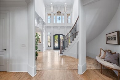 Entryway featuring baseboards, wood finished floor