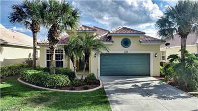 Mature and tropical landscaping adorns the front yard