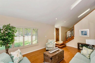 Formal living room with wood floors and