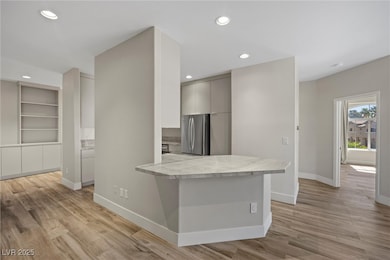 Kitchen featuring recessed lighting, light counter