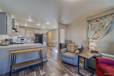 Kitchen featuring dark wood finished floors, white