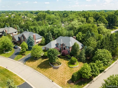 View of subject property with a forest