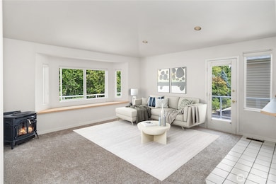 Virtually staged, hearth room next to kitchen.