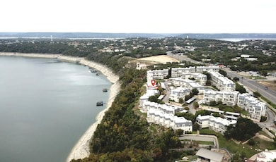 View of property location with a nearby body of w