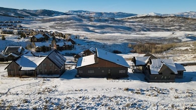 Snowy aerial view featuring a mountain view