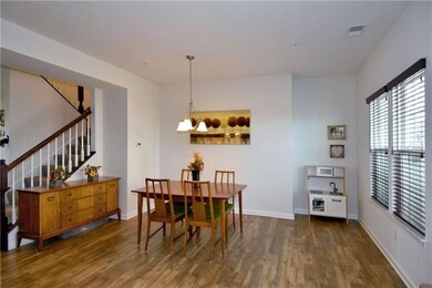 Notice the beautiful engineered hardwood flooring.