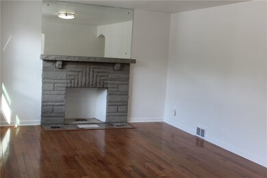 Living room, with decorative fireplace and new har
