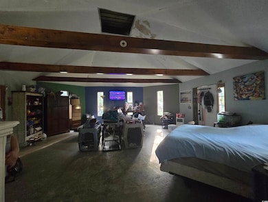 View of bedroom with beams