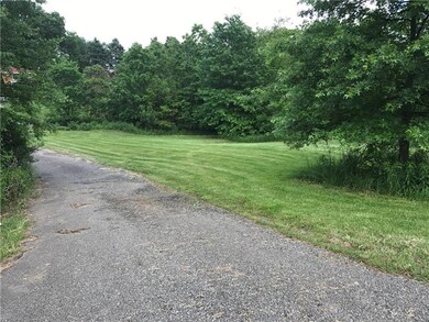 The small asphalt path divides the property making