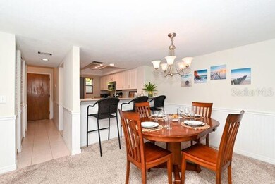 Open dining area with additional seating at counter.