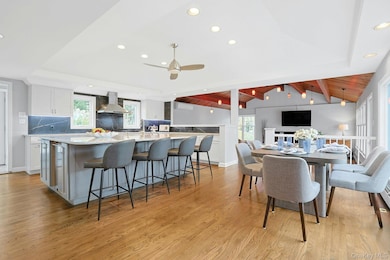 Kitchen with center island and view of family room