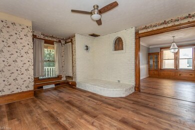 Front charming living room with original woodwork 