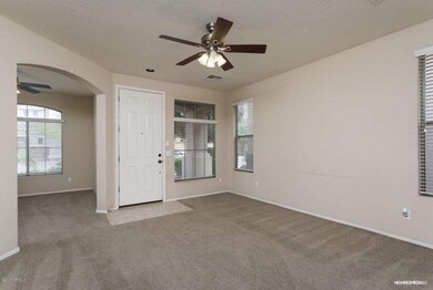Entry and arch opening to Den/Bedroom #3