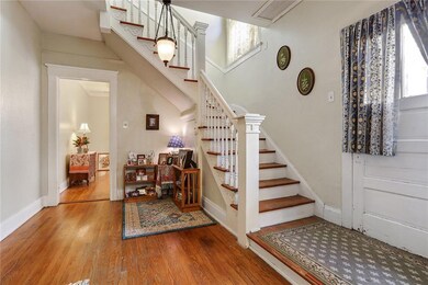 7902 Sycamore, stairs to 2nd floor, with door to d