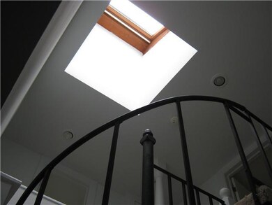 Foyer View of skylight over spiral staircase
