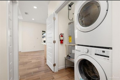 Bathroom featuring vanity, visible vents, wood tiled floor, and toilet