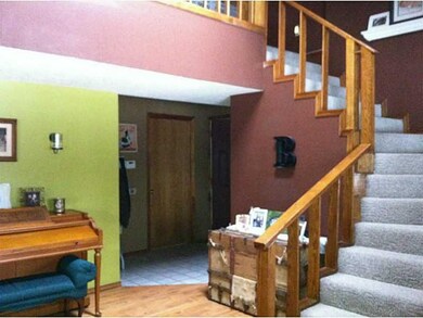 Living Room. Hall leads to first floor bath and ga