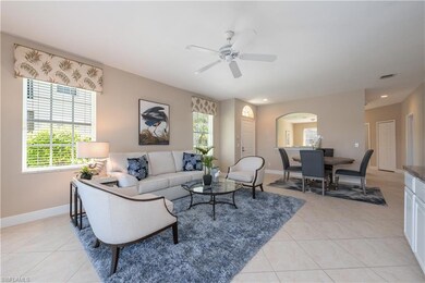 Tiled living room with ceiling fan