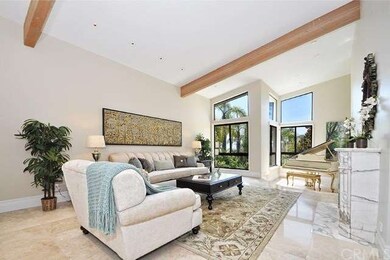 Living room with marble fireplace and music area