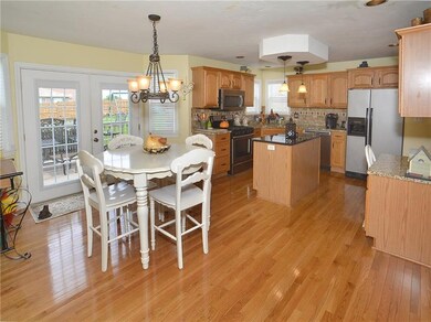 Spacious breakfast nook opens to the deck and back