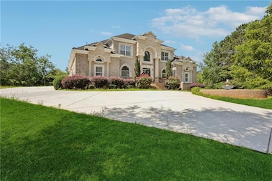 Mediterranean / spanish home featuring brick siding and a front lawn