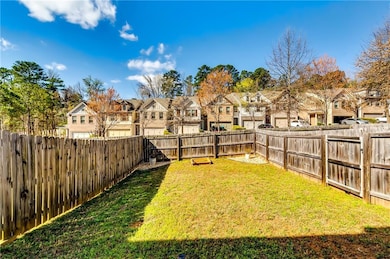 View of yard featuring a residential view and a fe