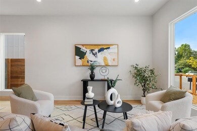 Living area featuring wood finished floors and recessed lighting