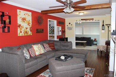 View 2 of Family Room with exposed beams looking i