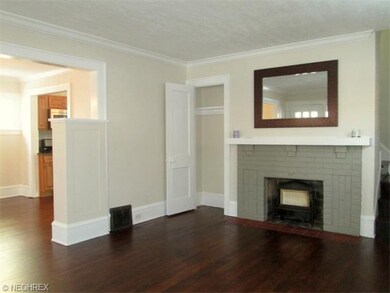 Living room with beautiful hardwood floor, crown m