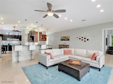 Living room featuring ceiling fan
