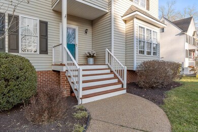 Freshly painted front porch rails and stained cove