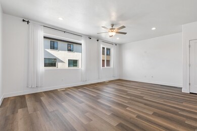 Spare room featuring dark wood finished floors, recessed lighting, and a ceiling fan