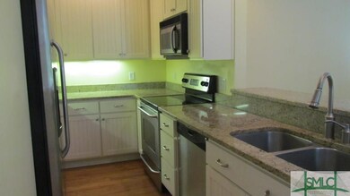 Kitchen area includes, refrigerator, microwave, ov