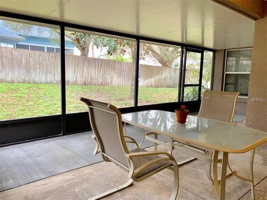 back screened/covered lanai wraps around toward di