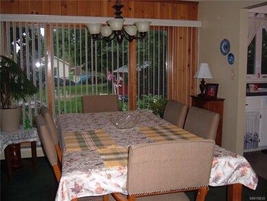 Dining room with updated light fixture overlooks p