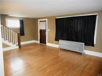 Living Room with hardwood flooring. Freshly painte