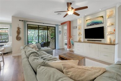 Living room featuring visible vents, built in feat
