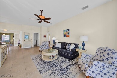 Living area featuring tile patterned floors, visib