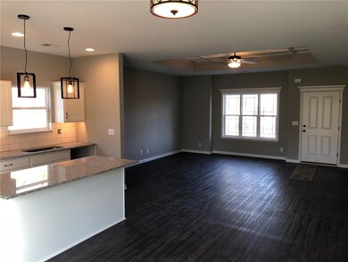 Open living room, kitchen and dining room area.