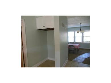 Space for the frig, door to laundry room at left