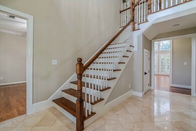 Entry foyer with marble flooring