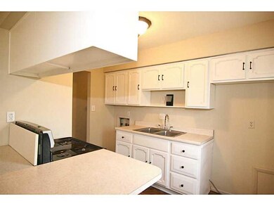 Kitchen. Another view of the kitchen. Cute breakfast bar for additional seating.