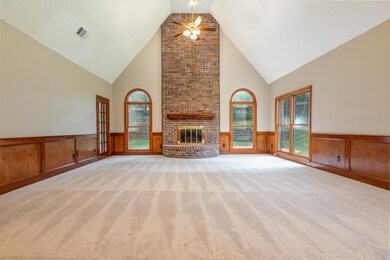 Enormous great room with vaulted ceiling and firep