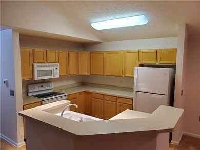 Open kitchen with lots of cabinet space, island wi