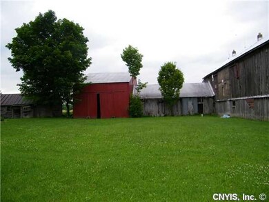 Exterior Front. Red barn near left boundary-pole s