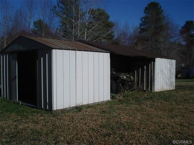 2 detached storage sheds with lean-to between them