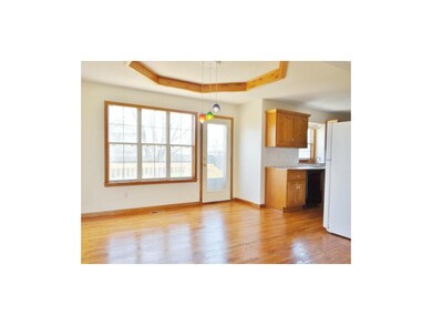 The dining room has access to the kitchen and feat