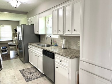 Tons of cabinets and multiple pantries make this beautiful updated kitchen a chefs dream