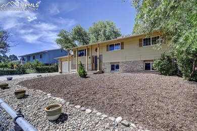 Raised ranch featuring a garage